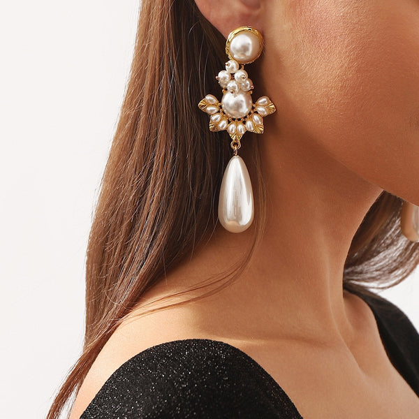 Faux pearl droplet shaped stud earrings